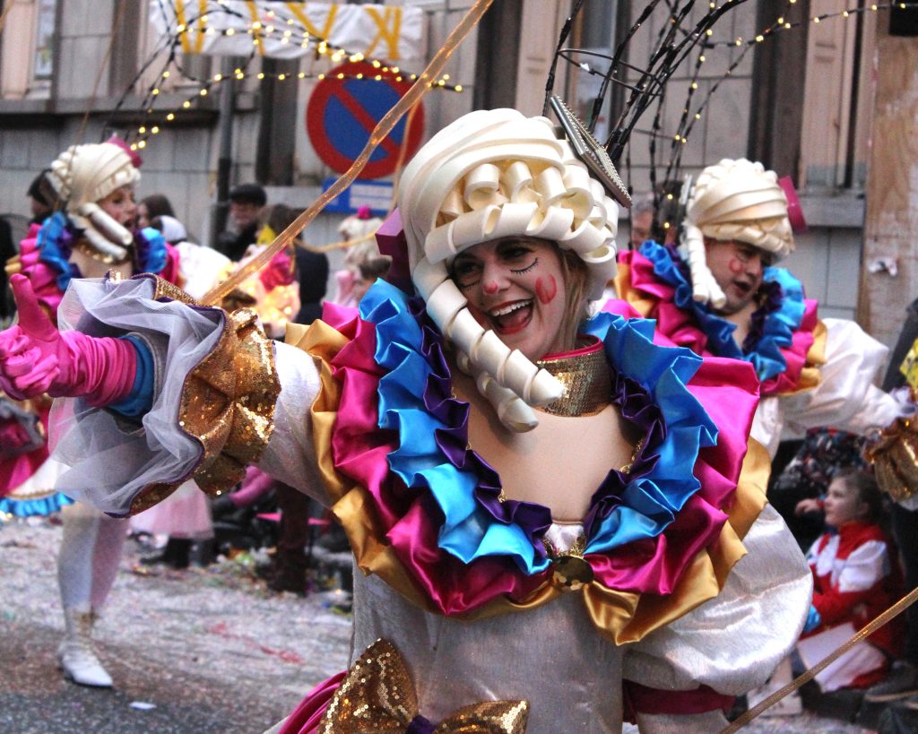 Unknown female dancer enjoying the parade during the annual carnival in Aalst, which is a UNESCO recognized event of Intangible Cultural Heritage.