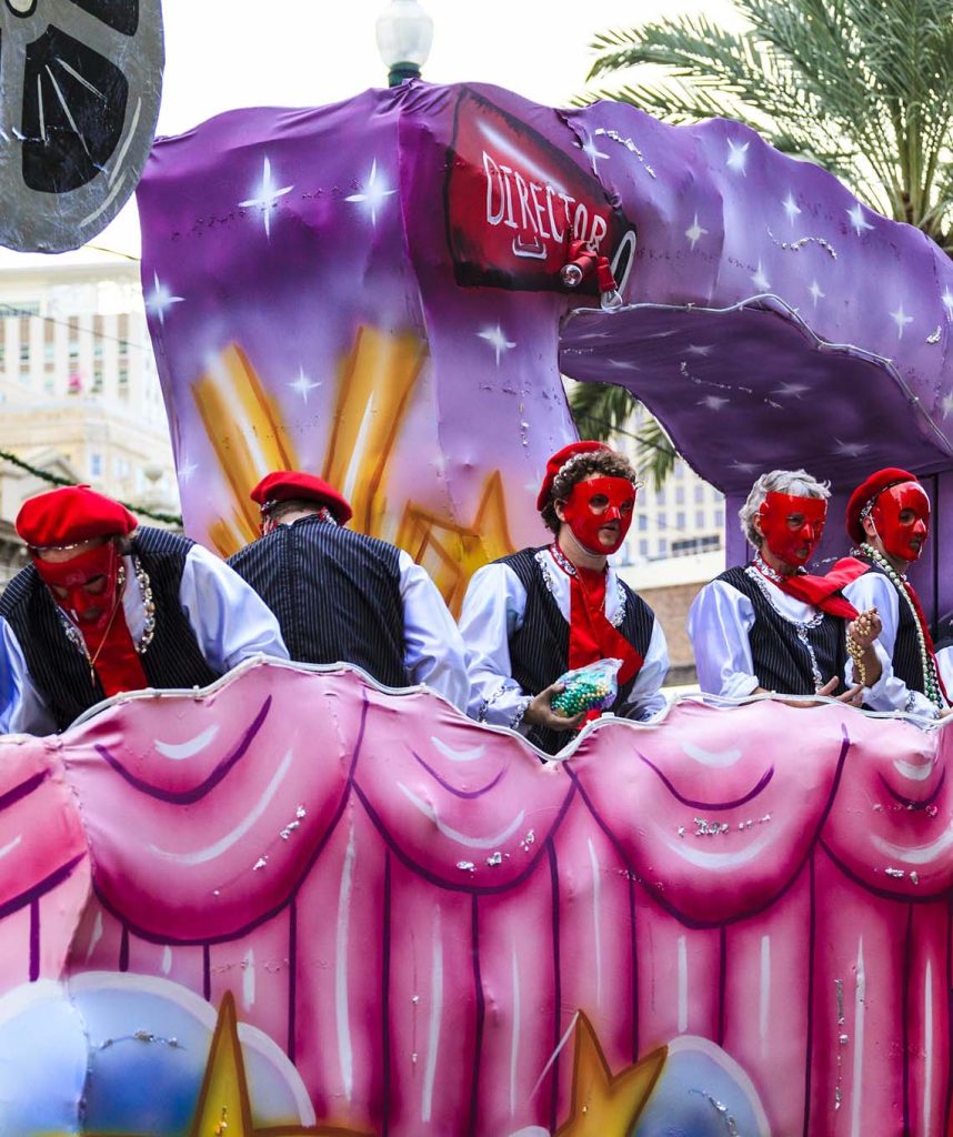 Cupcake-themed float parading at Hollywood Carnival with colorful decorations