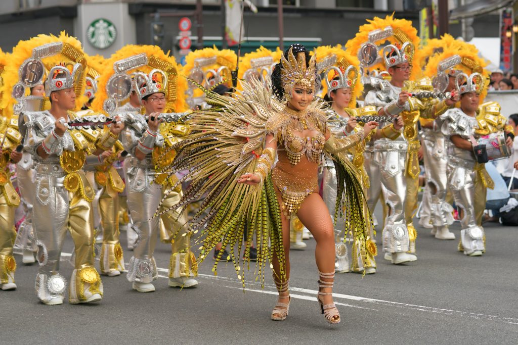 Tokyo, Japan - August 26, 2017 : Female participant wearing a gorgeous costumes dancing on the street at the 36th Asakusa Samba Carnival.