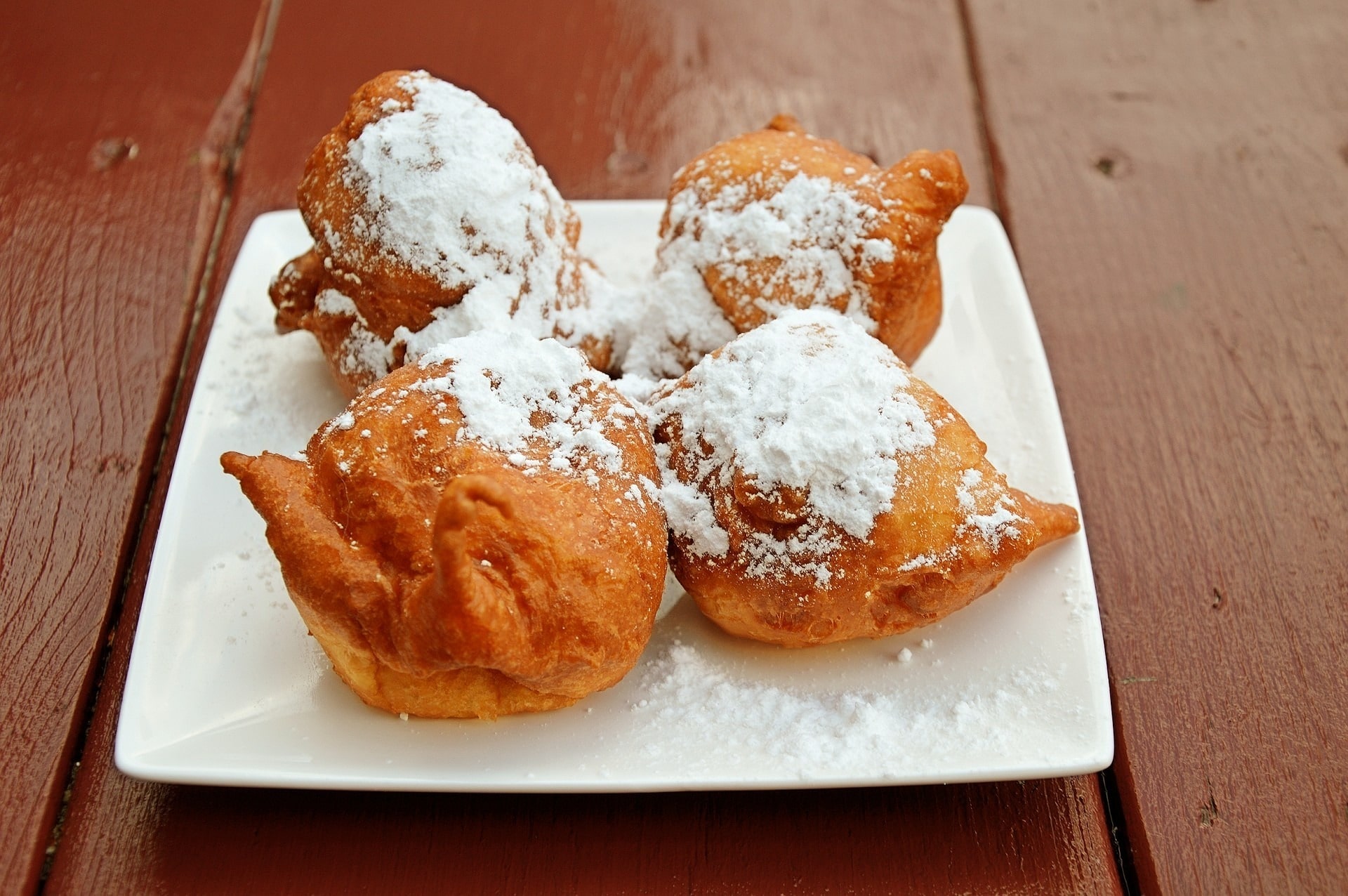 Traditional Italian Chiacchiere pastries dusted with powdered sugar, enjoyed during Carnival celebrations