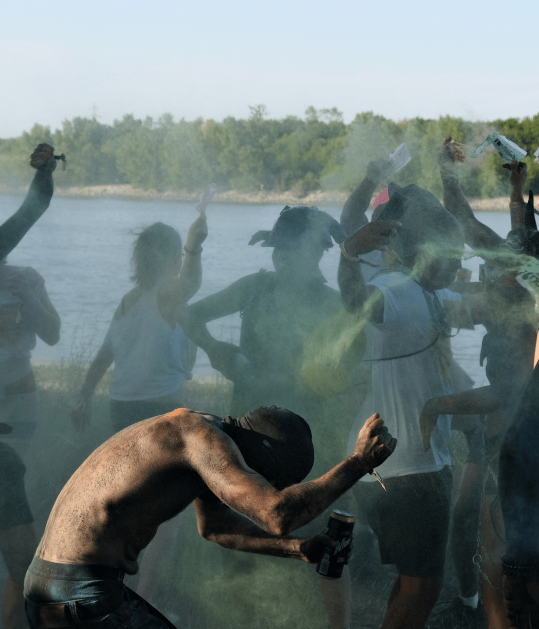 Man covered in a cloud of paint and powder at the Vienna Carnival Misbehave J’Ouvert 2025, capturing the vibrant energy of the Caribbean-inspired street party.