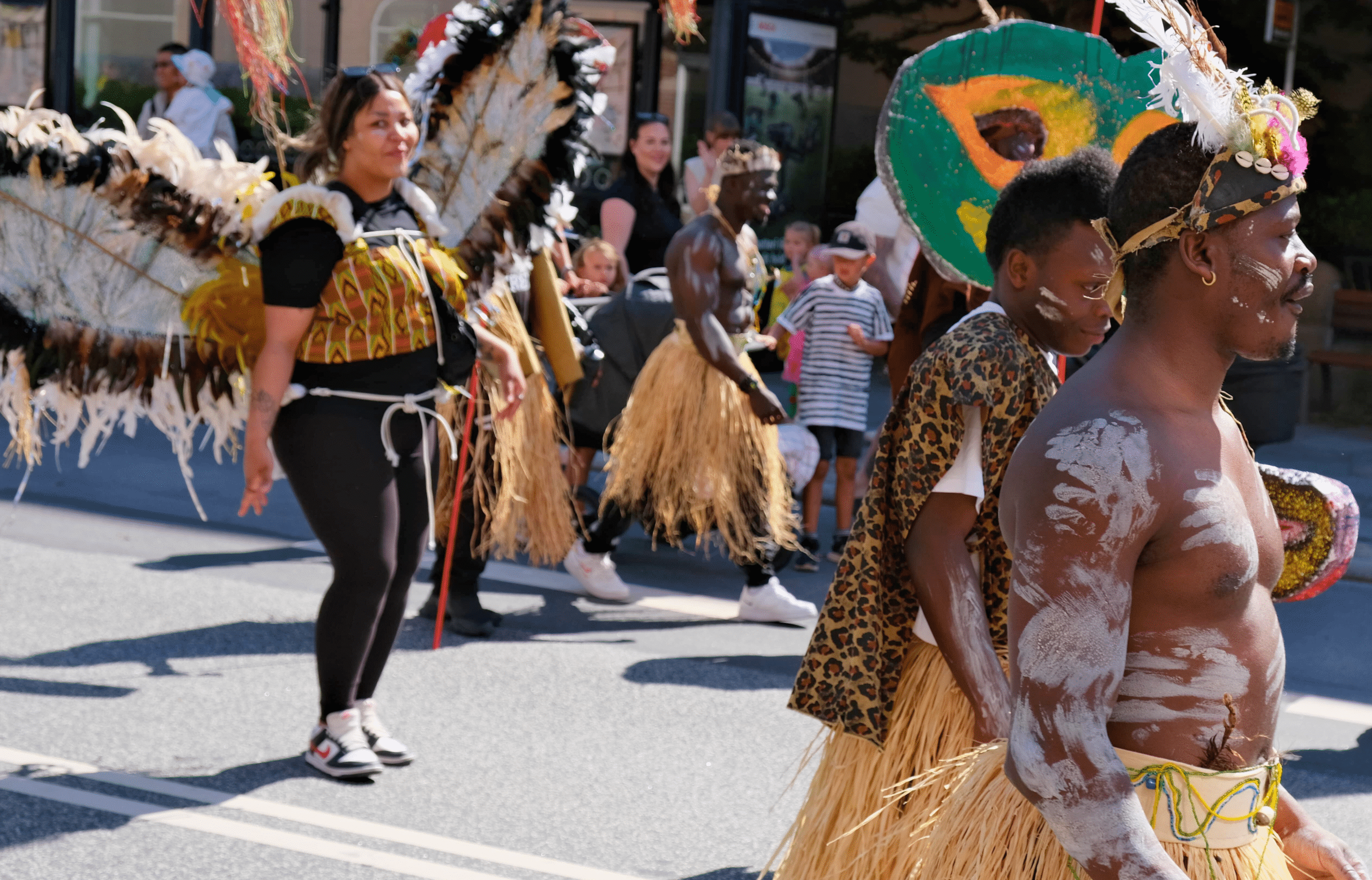 Group representing African culture with traditional costumes and dance at Aalborg Karneval 2024 in Denmark.