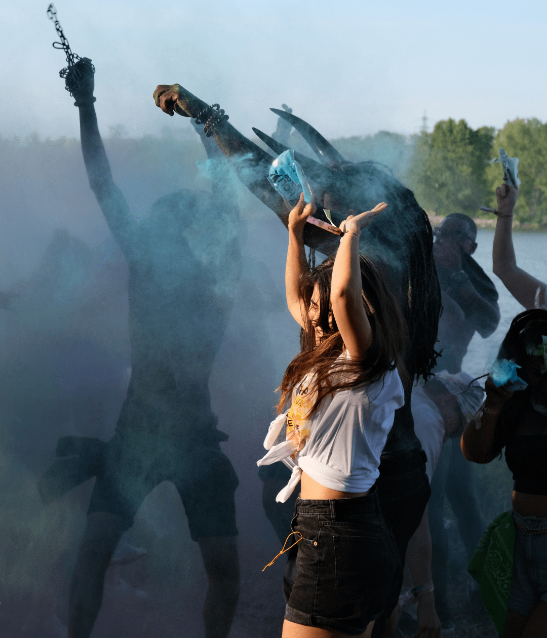 Cheerful woman covered in paint and powder at the Vienna Carnival Misbehave J’Ouvert 2025, celebrating with vibrant energy and Caribbean-inspired tradition.
