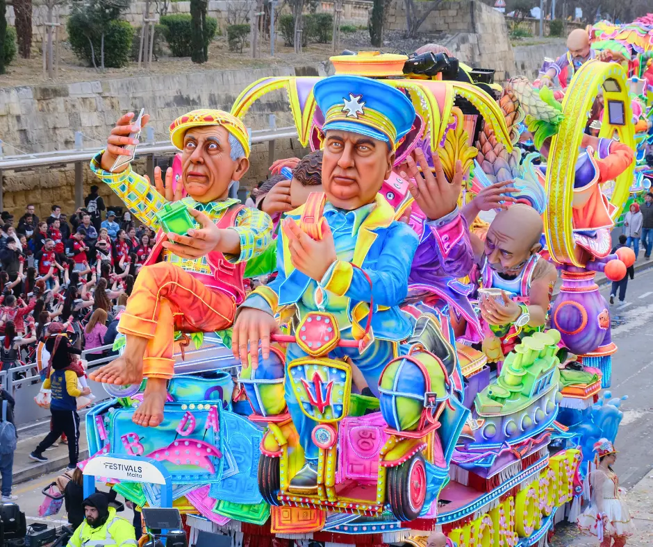 Vibrant satirical carnival float featuring oversized figures and bright colors at Malta Carnival 2026 in Valletta.