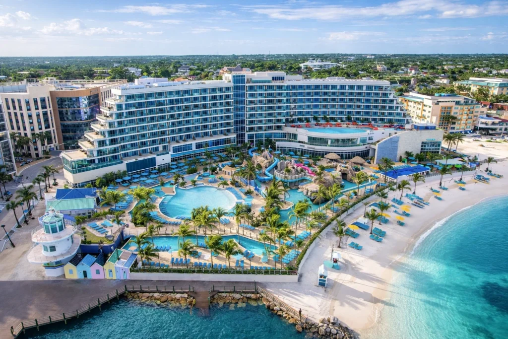 Aerial view of Margaritaville Beach Resort Nassau with beachfront pools, waterslides, and turquoise Caribbean waters – best hotels & areas to stay in nassau.