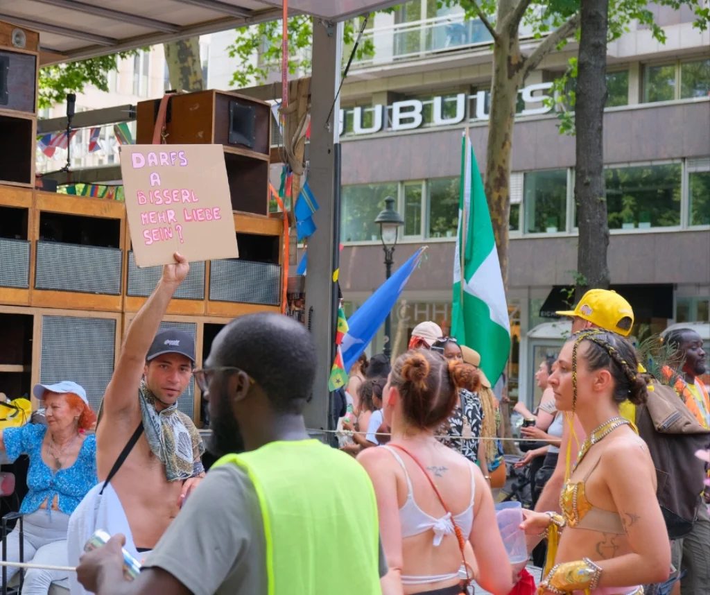 Street party with music speakers and carnival attendees celebrating at Vienna Carnival in Vienna, Austria.