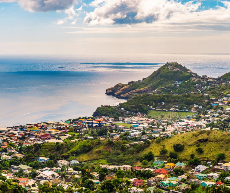 Panoramic view of St. Vincent coastline, hills, and town near top VincyMas Hotels and carnival destinations.