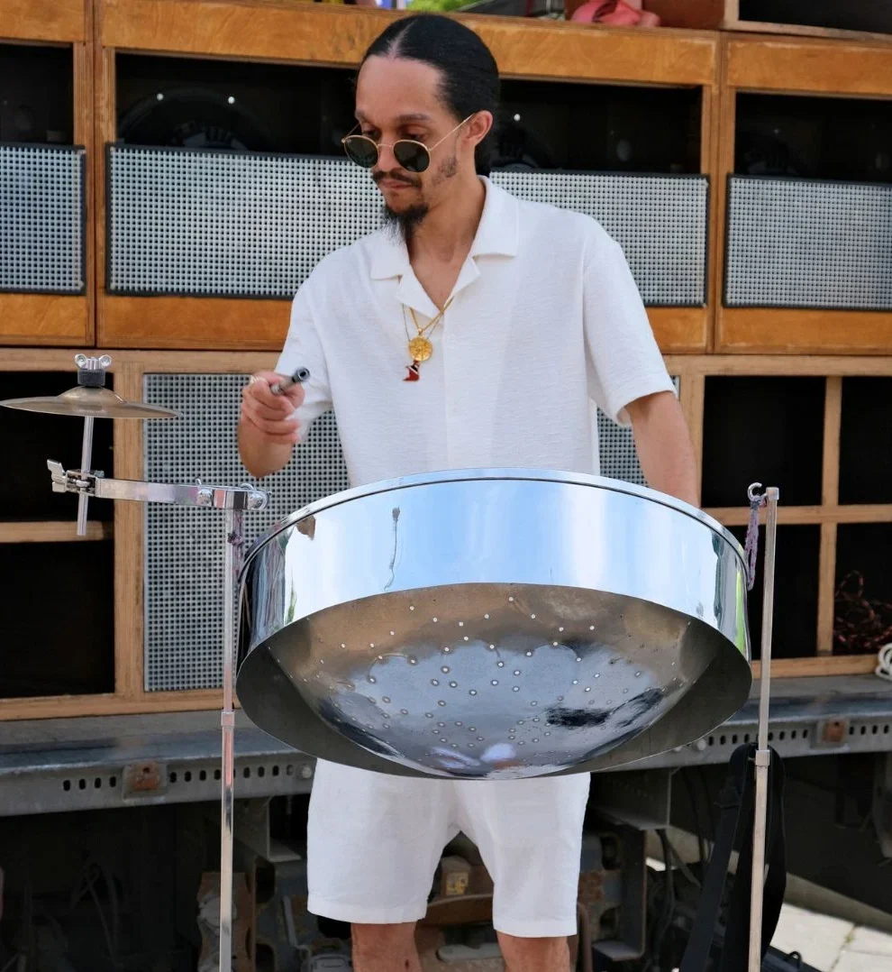 Steelpan musician performing live at Vienna Carnival in Austria with a steel drum instrument