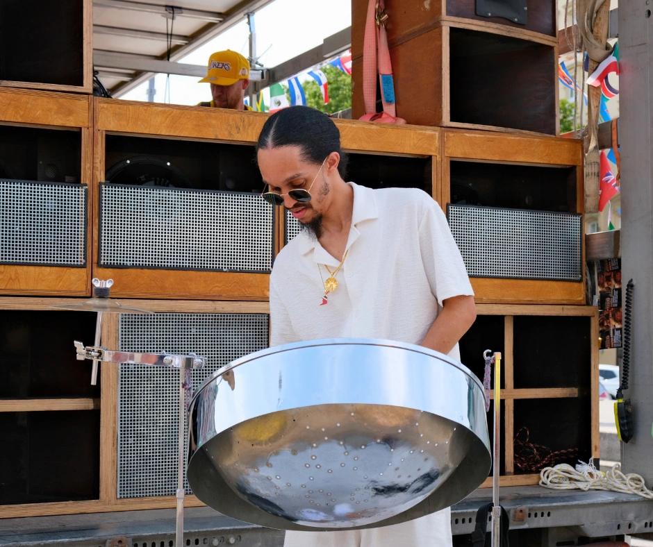 Steelpan musician playing a steel drum at Vienna Carnival in Austria during a live street performance