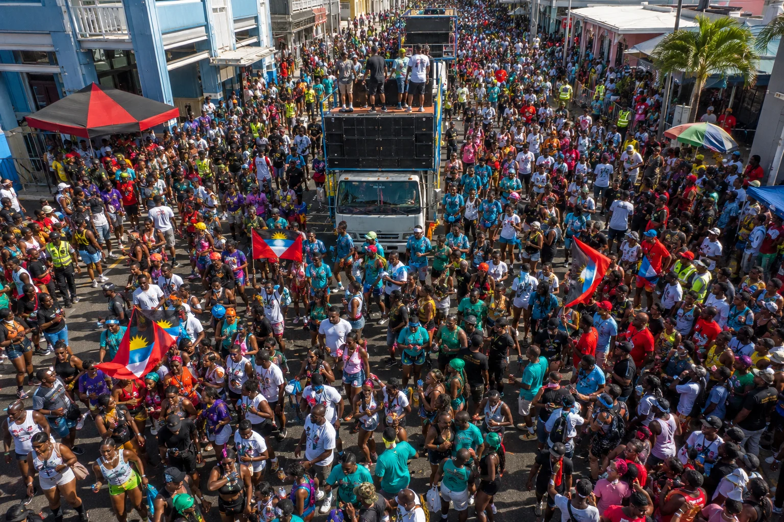 AI-generated aerial illustration of Antigua Carnival T-Shirt Mas in St. John’s showing revelers dancing behind music trucks during one of the top events on the list of Caribbean carnivals.