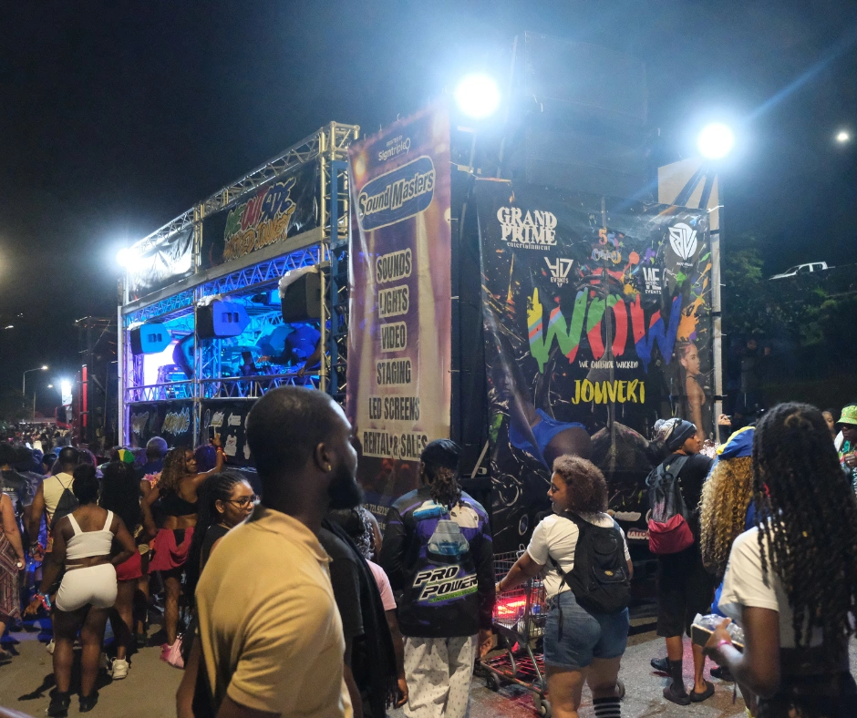 Crowd gathered near a Jouvert music truck during an early morning Carnival celebration