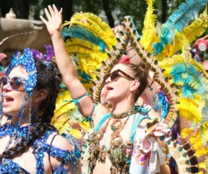 Masqueraders in colourful feathered carnival costumes at Munich Carnival 2026 road march