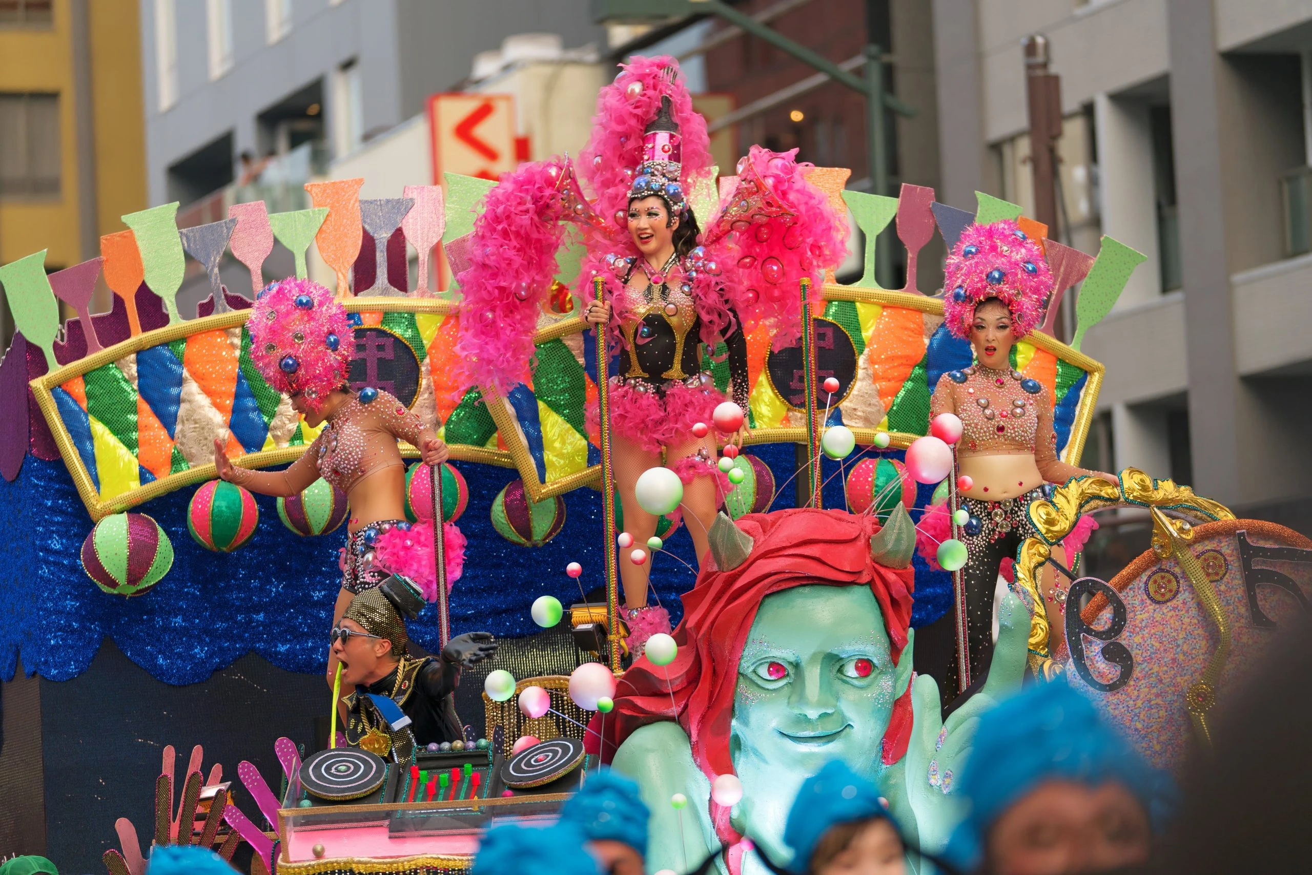 People in silly costumes riding on an eye-catching float at the Asakusa Samba Carnival in Tokyo