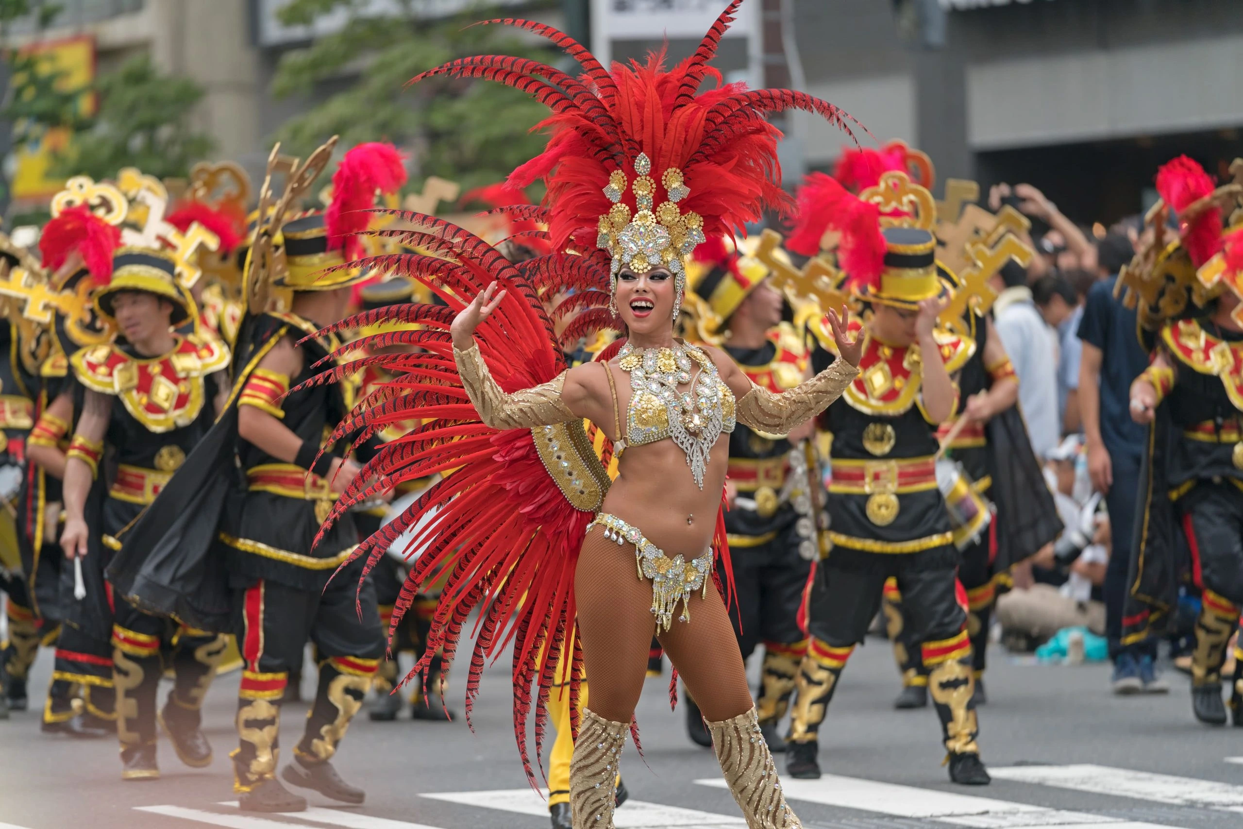 Samba dancer leading her troupe in colorful costumes at the JAsakusa Samba Carnival in Tokyo