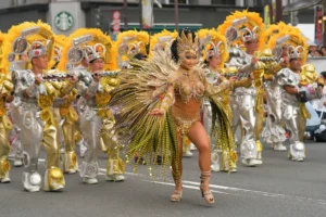 Tokyo, Japan - August 26, 2017 : Female participant wearing a gorgeous costumes dancing on the street at the 36th Asakusa Samba Carnival.