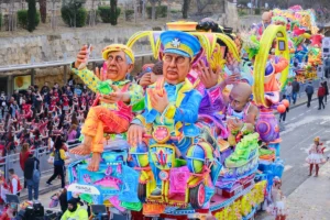 Colorful satirical float parading through Valletta Malta Carnival — what to do when carnival is canceled and you're already there