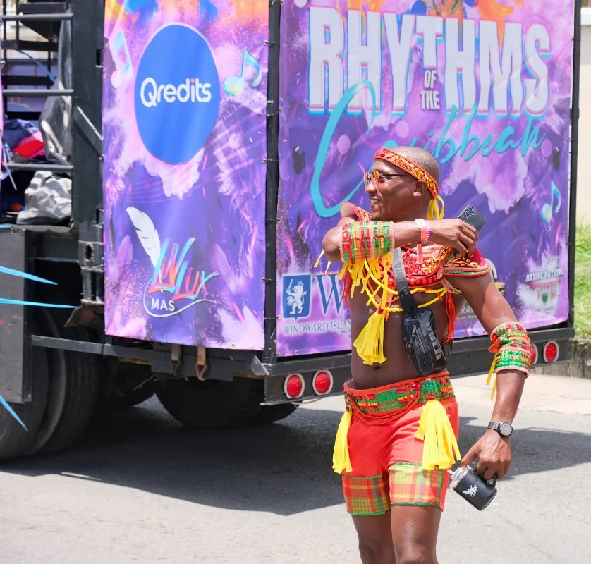 Masquerader in traditional Caribbean carnival costume on the road at SXM Carnival