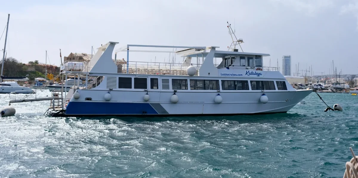 Luzzu Cruises boat docked in Sliema harbour Malta