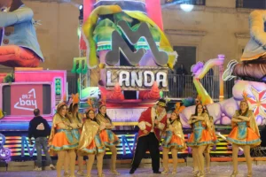 Malta Carnival itinerary evening parade float and costumed dancers in Valletta