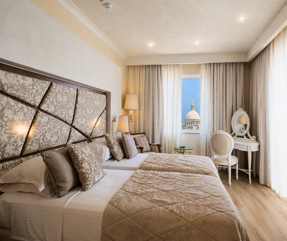 Twin room with a church dome view at a Osborne Valletta hotel for Malta Carnival