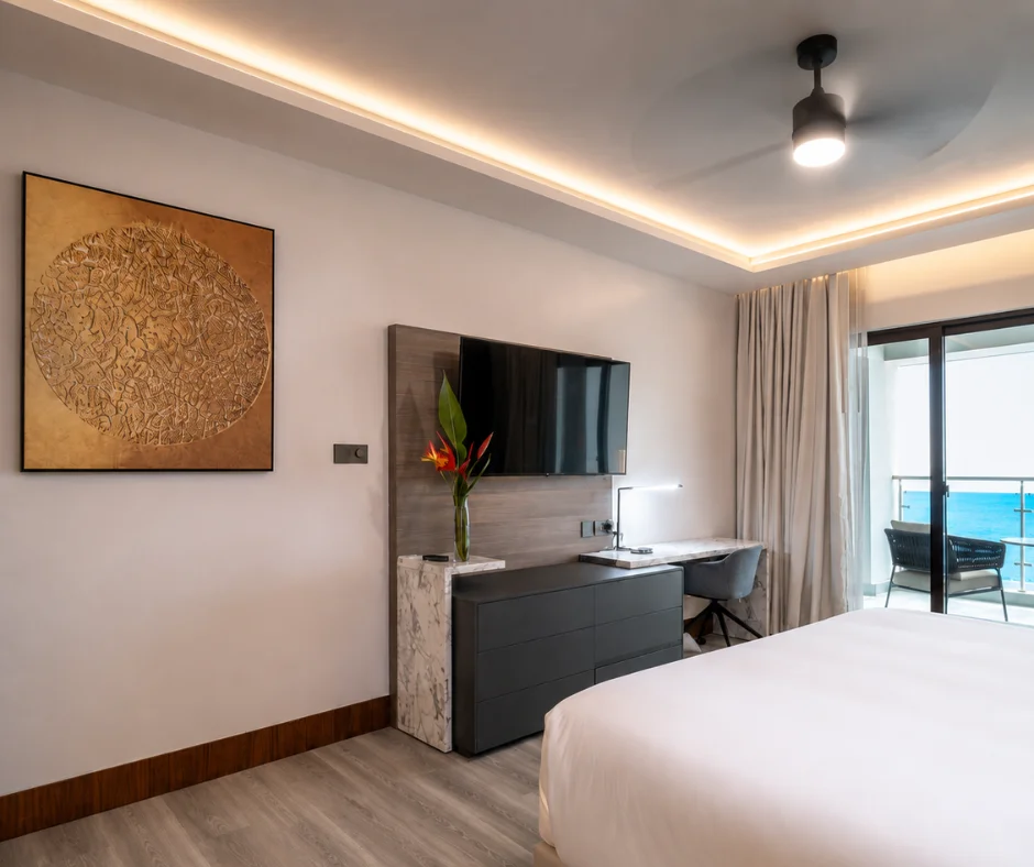 Modern guest room with a sea-view balcony at Ocean Oasis Hotel Dominica, a quieter base for where to stay for Dominica Carnival.