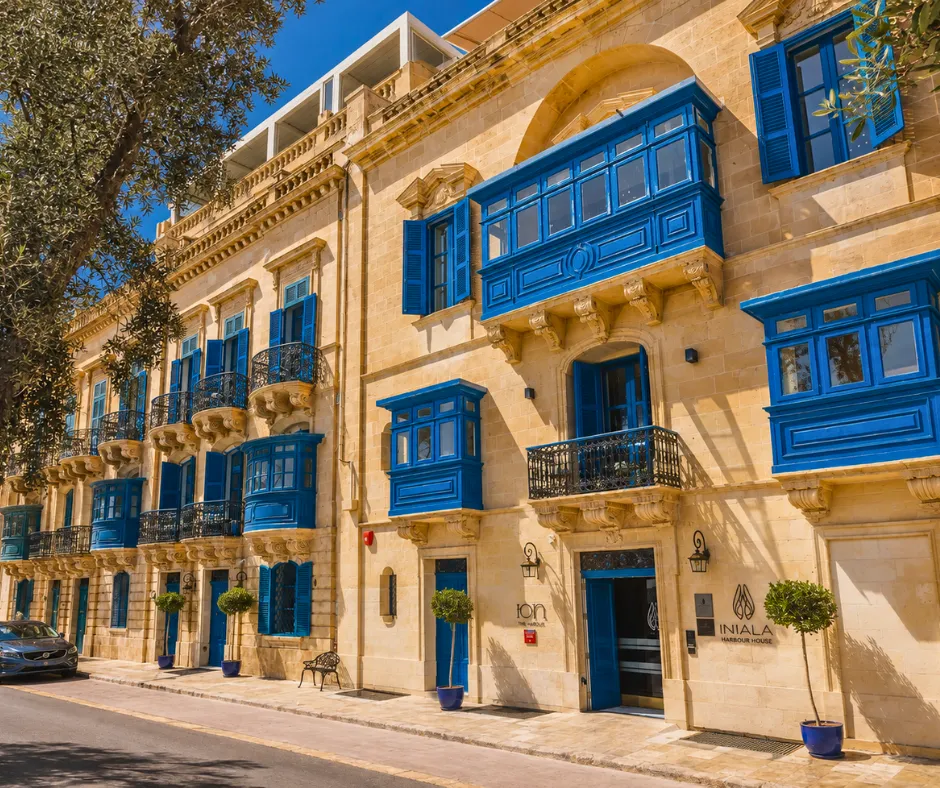 Blue timber balconies on the Iniala Valletta façade above the ION Harbour entrance
