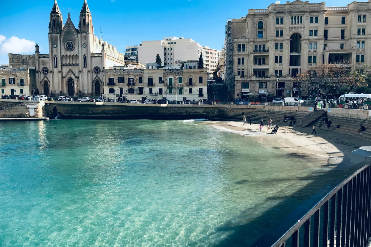 Balluta Bay between Sliema and St Julian’s, a waterfront option when choosing where to stay for Malta Carnival