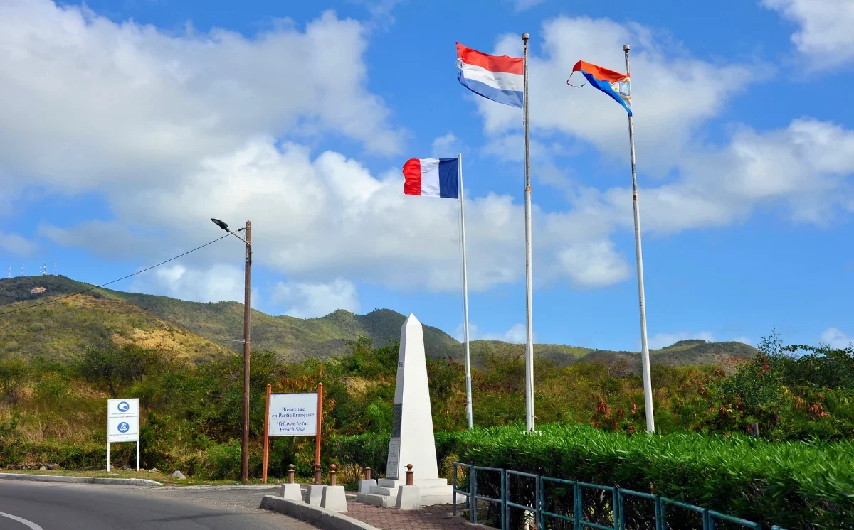 French and Dutch border monument between Saint Martin and Sint Maarten for travelers choosing where to stay for SXM Carnival