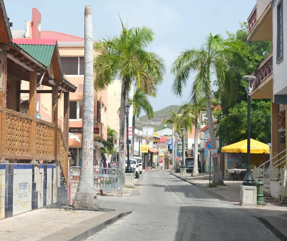 Front Street in Philipsburg lined with palm trees, one of the streets along the SXM Carnival parade route