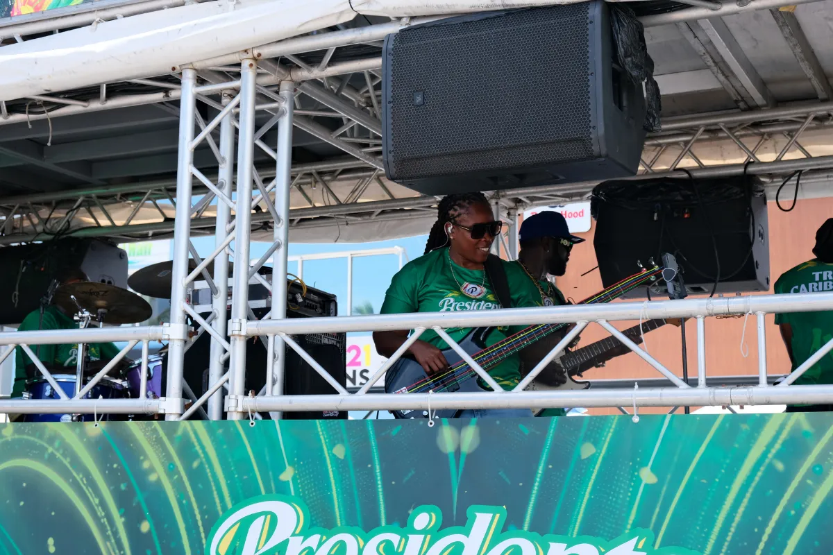 Live band performing on a music truck stage during a Caribbean Carnival parade