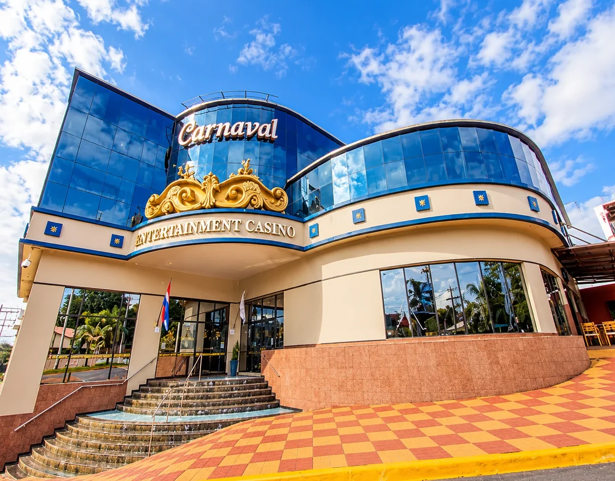 Blue glass and gold facade of Carnaval Hotel Casino in Encarnación