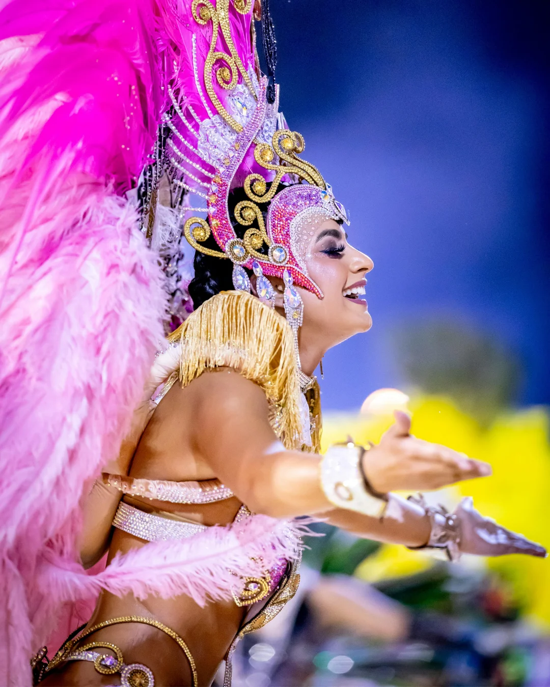 Samba dancer performing during Encarnacion Carnival in Paraguay wearing a sparkling silver and black costume with a feathered headdress