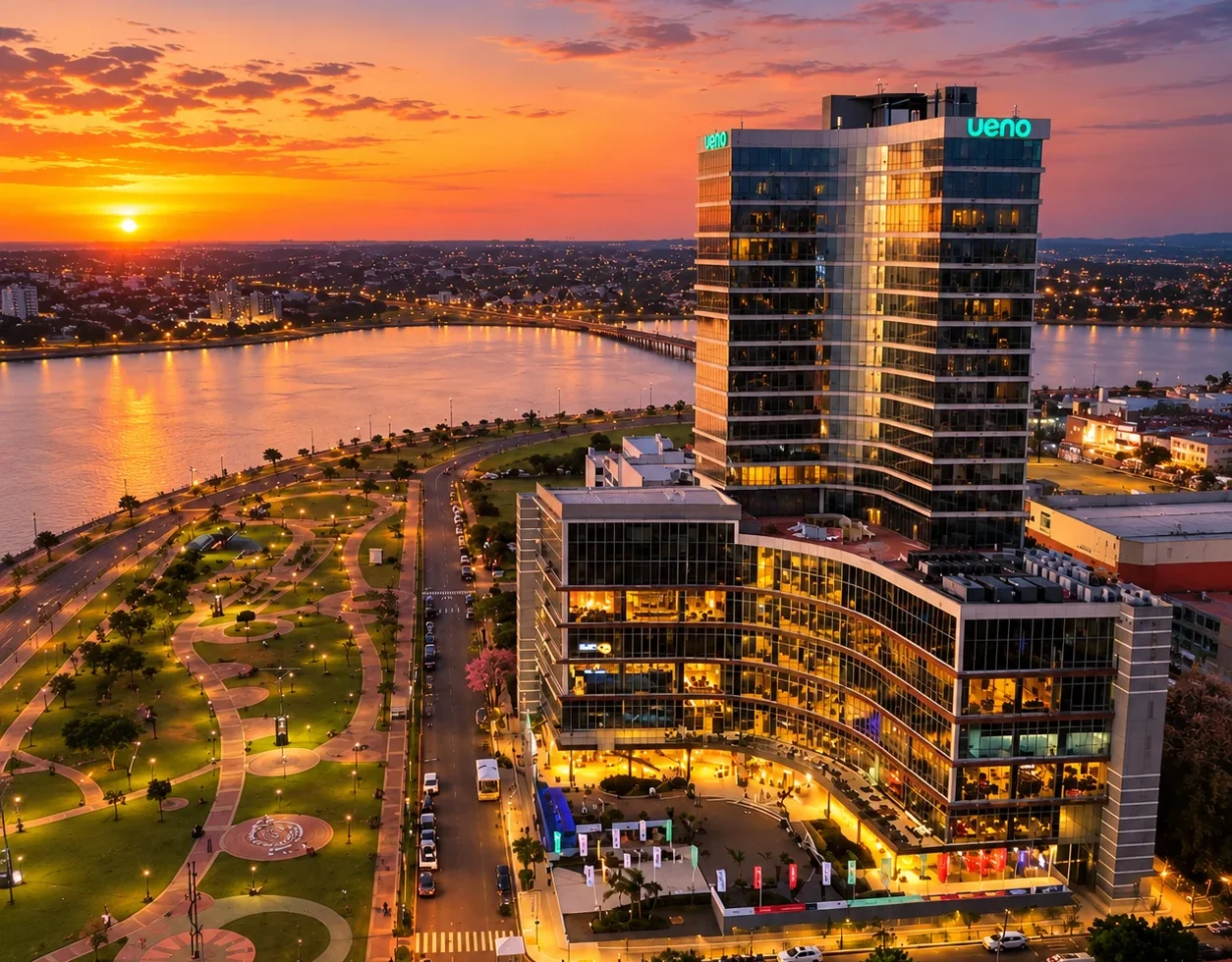 Aerial view of the Encarnación Costanera and the Paraná River at sunset, the best area to stay for Encarnación Carnival